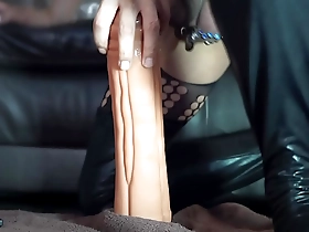 Anal masturbation with a big dildo in the form of a Chinese dragon cock