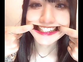 Short video of an Asian crossdressers fetish for teeth.