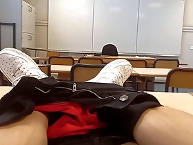 A young French-Asian man can not control his passion and pleases himself in a classroom full of students.