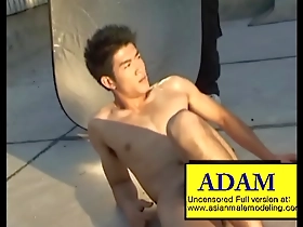 Adam, the Asian hunk showing off his muscles.