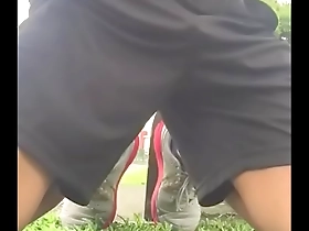 Young Asian boy enjoys giving oral sex outdoors