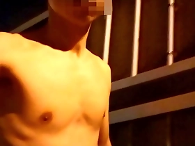Walking naked at night on a pedestrian bridge in Japan