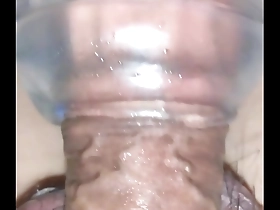 Close up of a big dick in a clear dildo