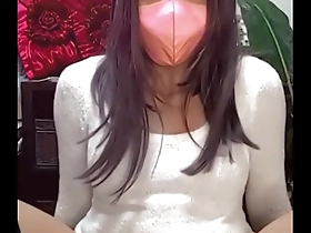 A masked up Femboy masturbates on live stream.