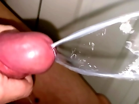 Close up and slow motion of a powerful Japanese man’s ejaculation.