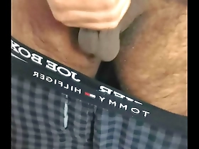 Young Indian man pleasuring himself and showing off his assets.