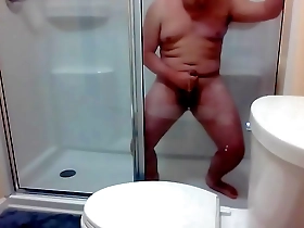 Big cock Asian stud has a solo session and cums hard in the shower.