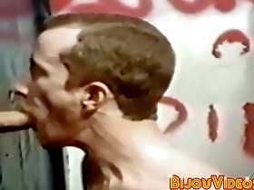 Classic glory hole scene with muscular men giving blow jobs and facial finish
