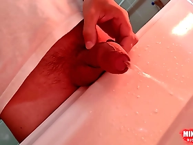 Young Japanese man urinates and masturbates in the washbasin